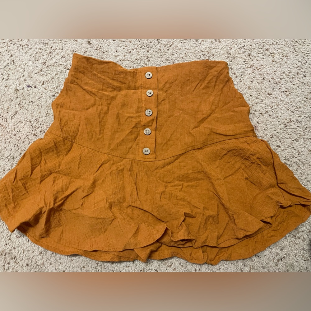 Orange skirt with shorts. Skort